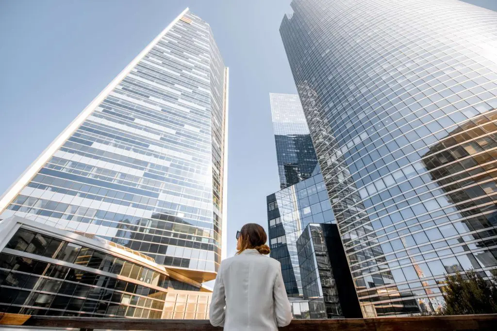 woman outside office building moving